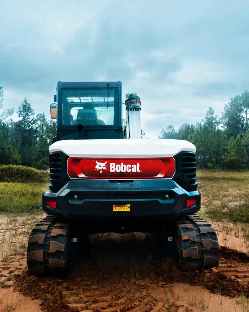Rear of the Bobcat E88 excavator on freshly graded sandy ground