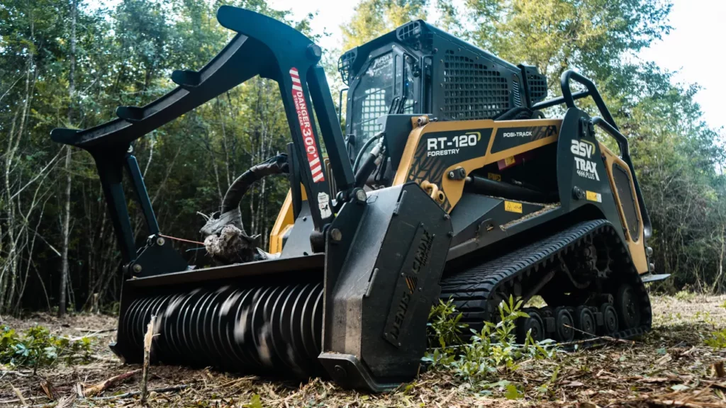 Close view of the forestry mulching head on the ASV RT-120 among cut brush